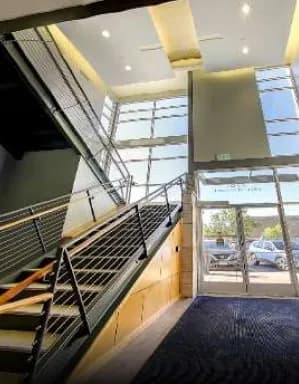 The office atrium with its staircase and glass entrance